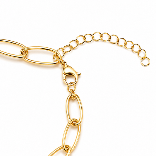 Gold chain bracelet on a white background