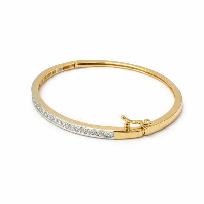 Gold bracelet with clear stones on a white background