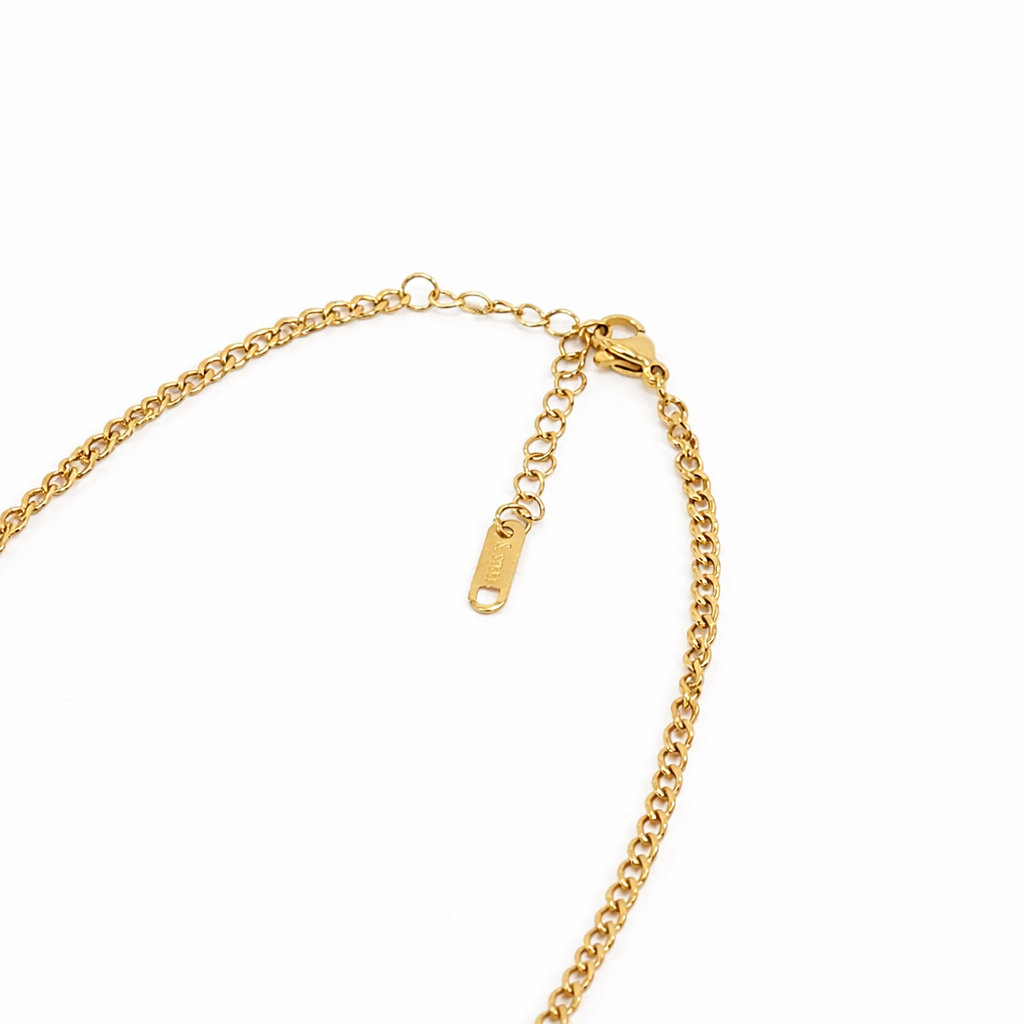 Gold chain necklace on a white background