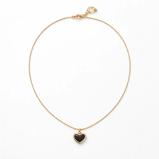 Close-up detail of Black Heart Gold Pendant Necklace showing gold-tone finish — BangleCart