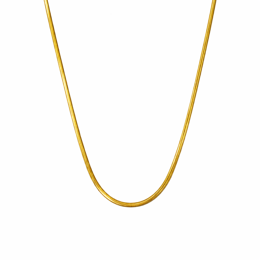 Gold chain necklace on a white background