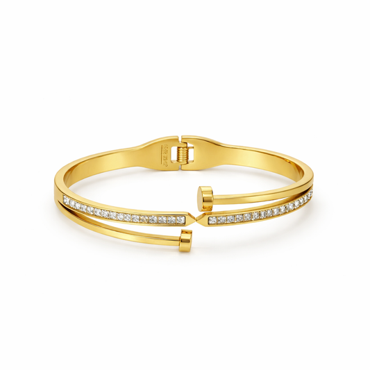Gold bracelet with diamond accents on a white background