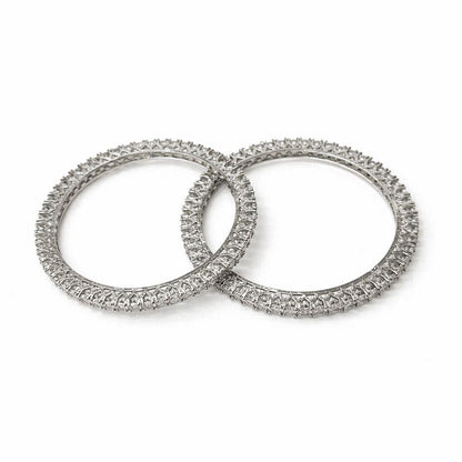 Two diamond-studded rings on a white background