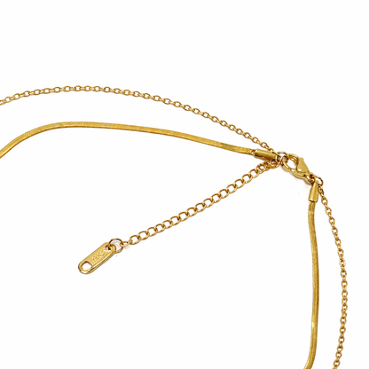Gold necklace on a white background