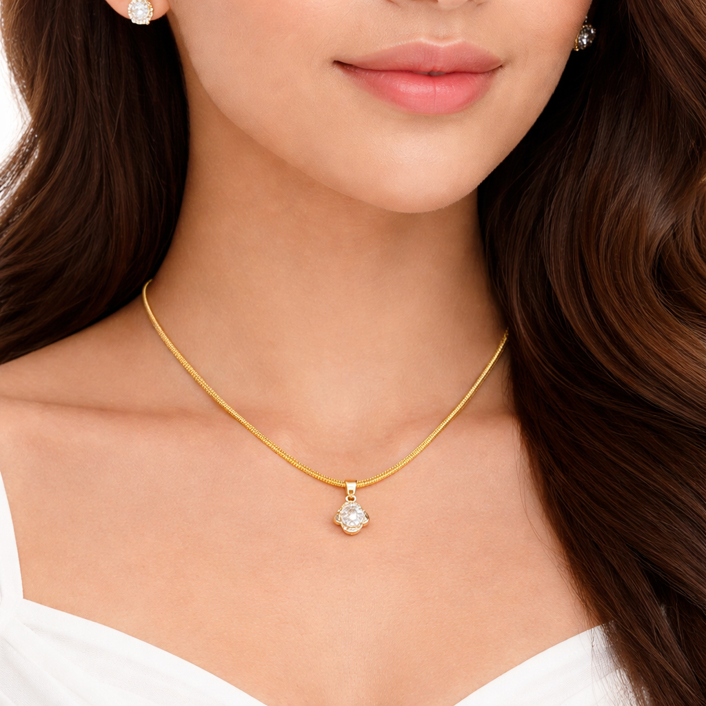 Close-up of a woman wearing a gold necklace with a diamond pendant.