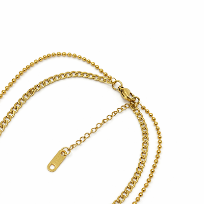 Gold chain necklace on a white background