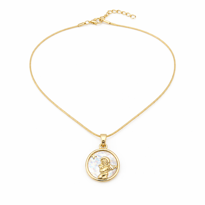 Gold necklace with a circular pendant on a white background