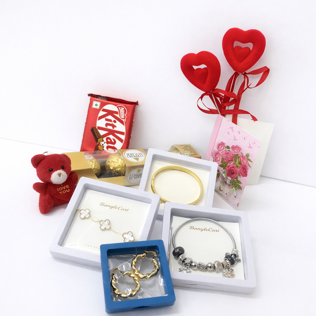 Collection of jewelry, a teddy bear, KitKat bar, and decorative hearts on a white background