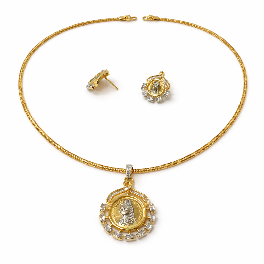 Gold necklace with pendant and matching earrings on a white background