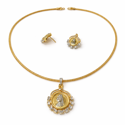 Gold necklace with pendant and matching earrings on a white background
