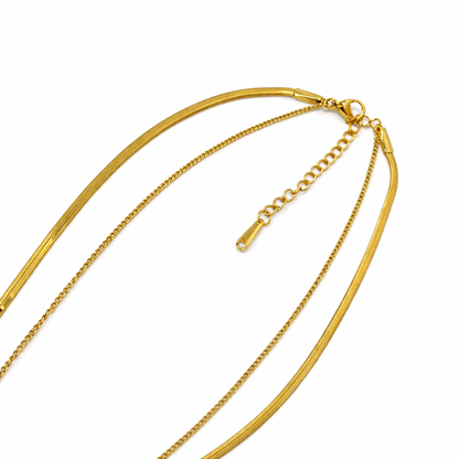 Gold chain necklace on a white background