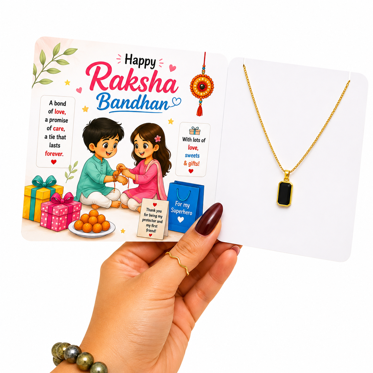 A hand holds a Raksha Bandhan gift set featuring a printed card with festive illustrations and text, alongside a gold necklace with a black rectangular pendant displayed on a small card.