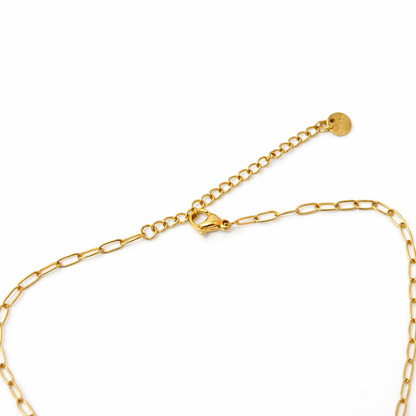 Gold chain bracelet on a white background
