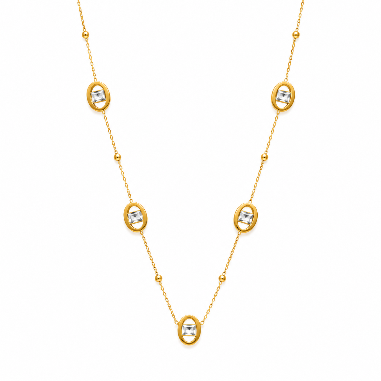 Gold necklace with diamond-like stones on a white background