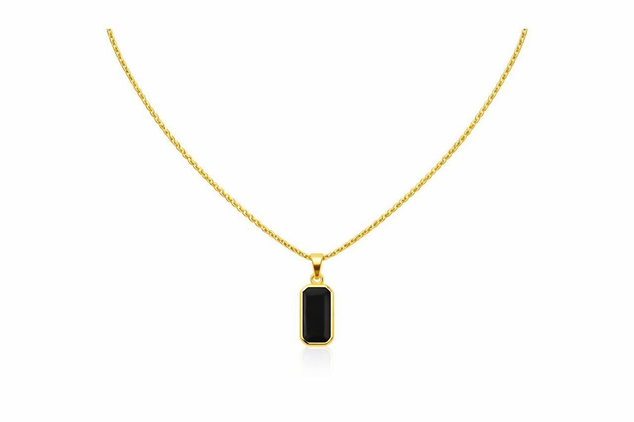 Gold necklace with a black pendant on a white background