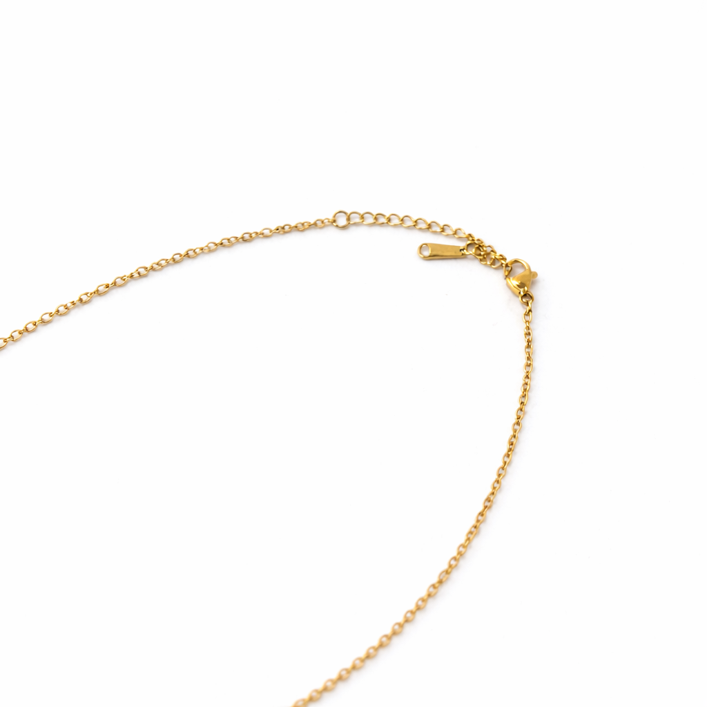 Gold chain bracelet on a white background