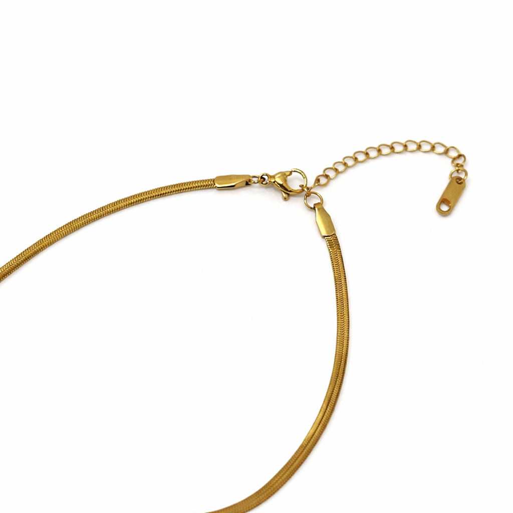 Gold necklace on a white background