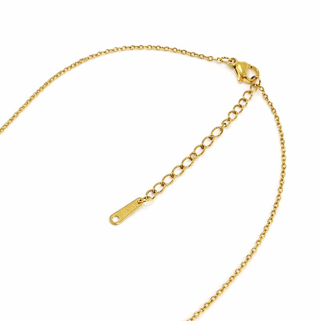 Gold chain necklace on a white background