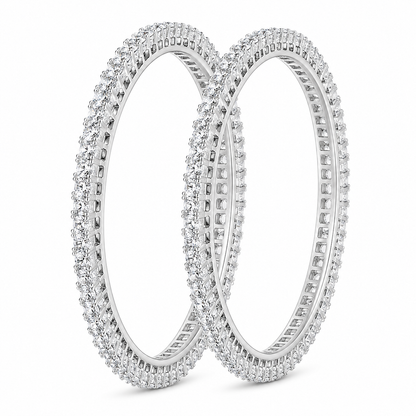 Two silver-toned eternity bangle bracelets, fully paved with small clear stones, displayed on a clean white background.