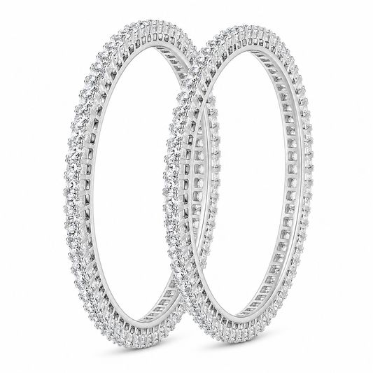Two silver-toned eternity bangle bracelets, fully paved with small clear stones, displayed on a clean white background.
