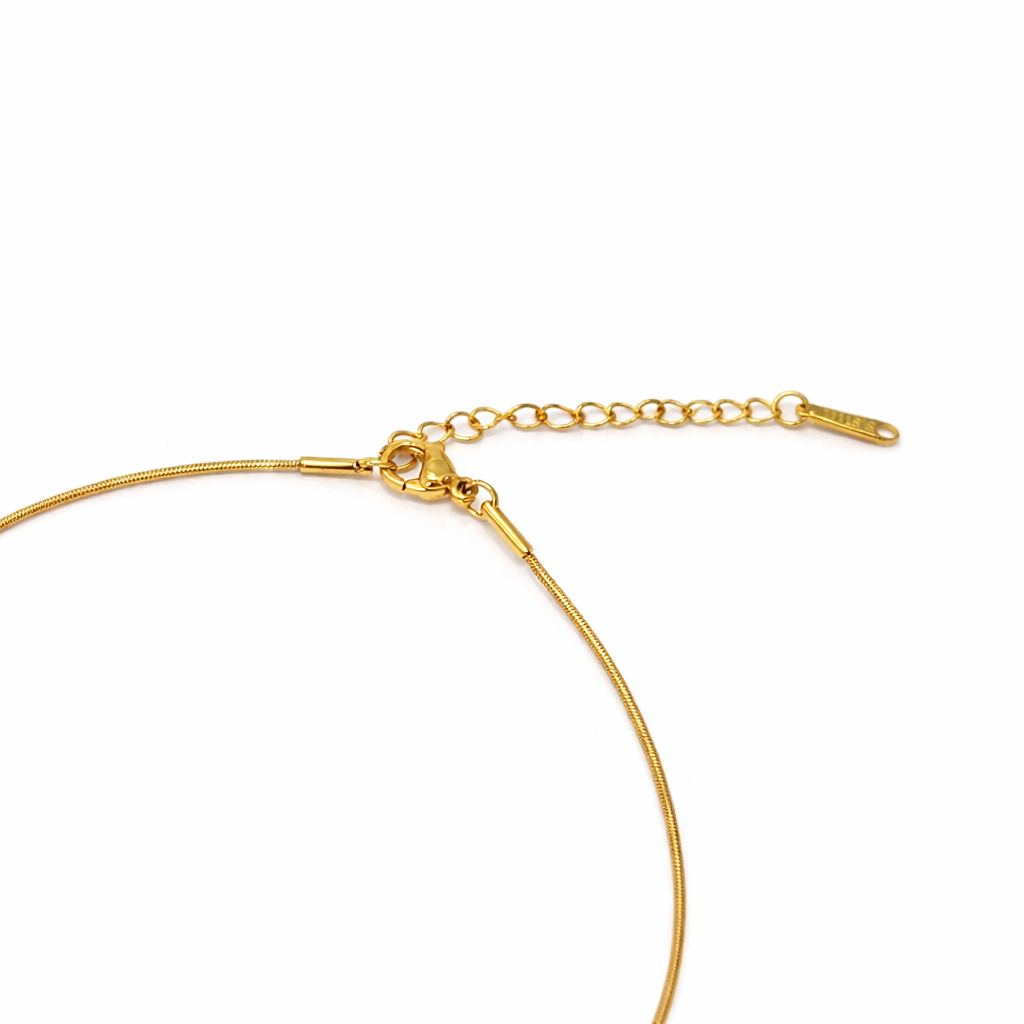 Gold necklace on a white background