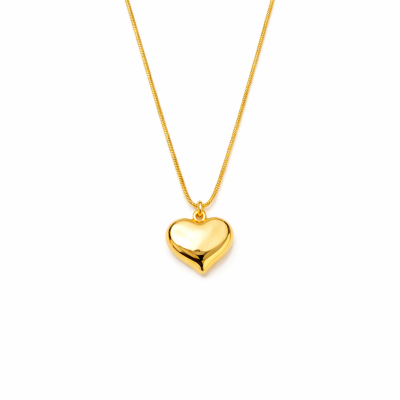 Gold heart-shaped pendant necklace on a white background