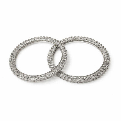 Two diamond-studded rings on a white background