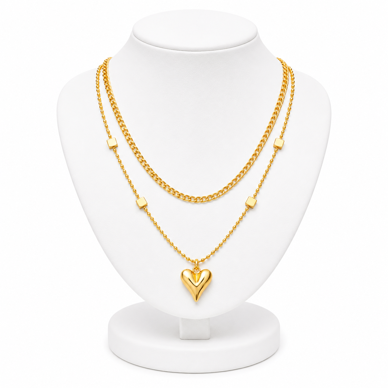 Gold necklace with a heart pendant on a white mannequin bust
