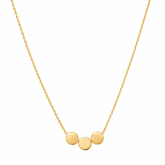A delicate gold chain necklace featuring three small, flat circular gold discs spaced evenly along the chain, presented on a clean white background.