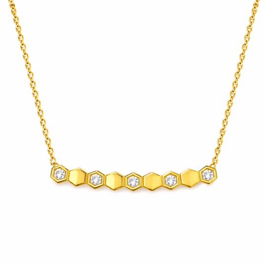 Gold necklace with hexagonal diamond pendants on a white background