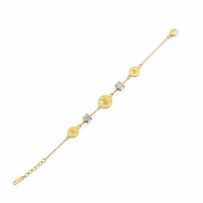 Gold bracelet with various charms on a white background