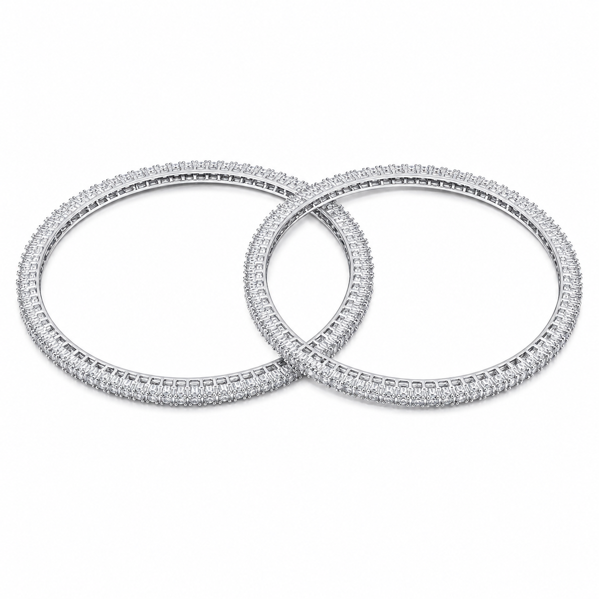 Two overlapping silver-toned bangles covered in small clear stones, displayed on a clean white background.