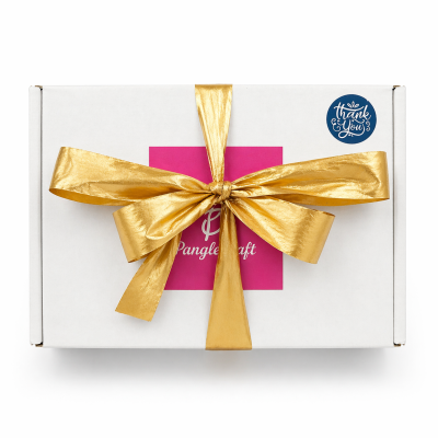Gift box with a gold ribbon and pink card on a white background