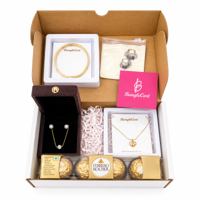 Jewelry set with necklaces, earrings, and chocolates in a box