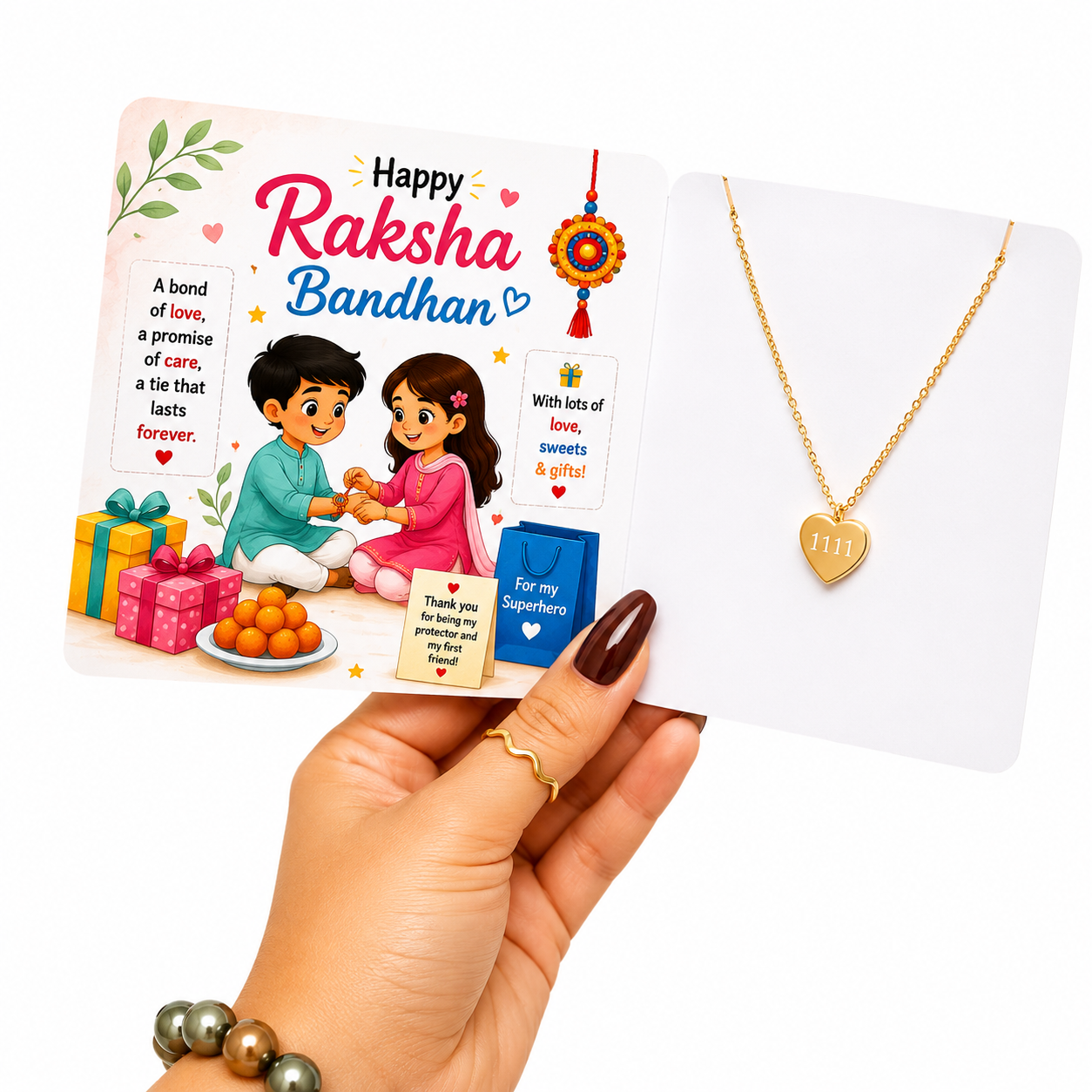 A hand holds a Raksha Bandhan gift card next to a gold heart-shaped necklace on a white display card. The card features festive illustrations of a boy and girl tying a cord with orange sweets and colorful presents, with the text 'Happy Raksha Bandhan'.