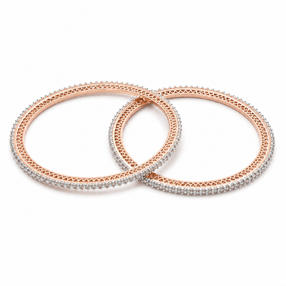 Two rose gold bangles with silver pavé crystal borders, overlapping on a solid white background.