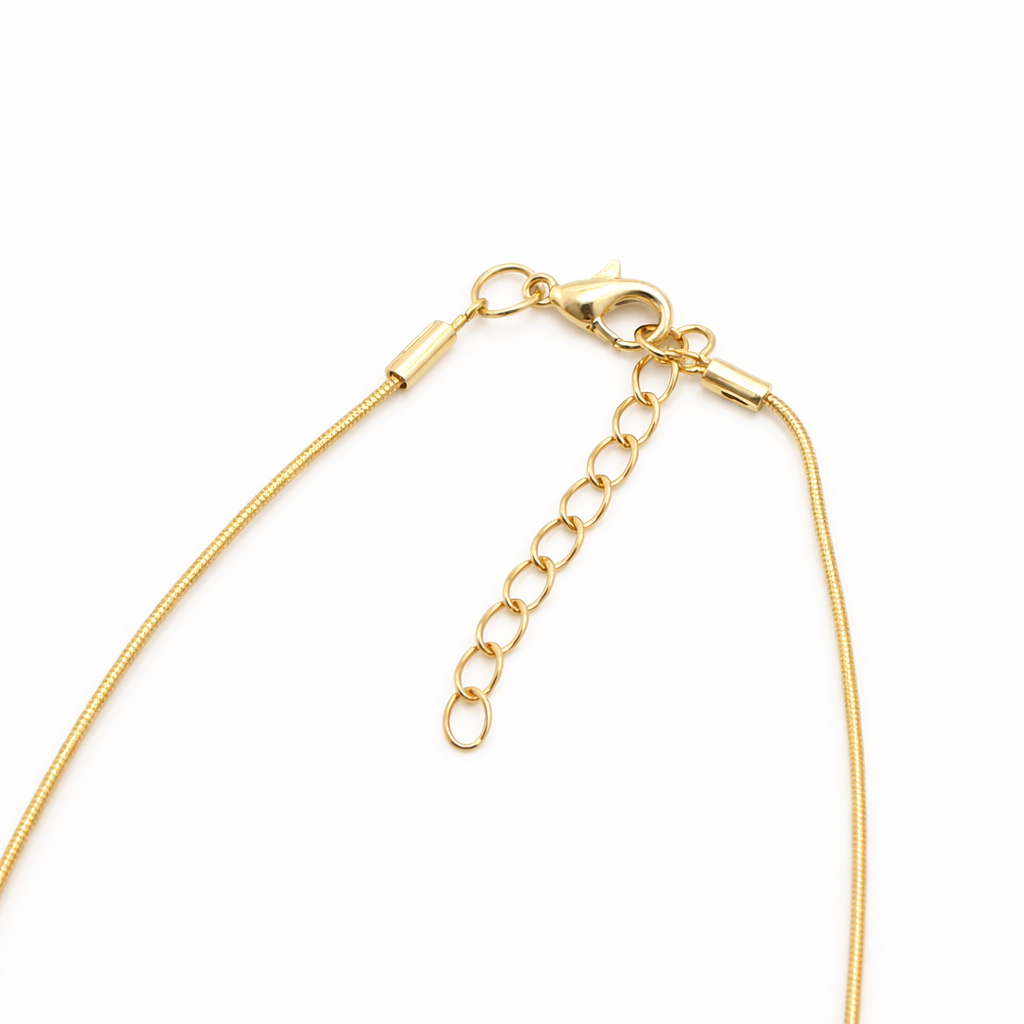 Gold necklace chain on a white background
