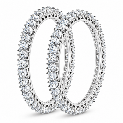 Two diamond eternity rings in silver-toned metal, shown overlapping on a clean white background.