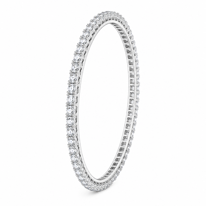 A single-row diamond tennis bracelet in a polished silver-colored metal, shown on a clean white background.