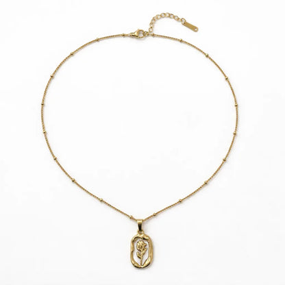 Gold necklace with a pendant on a white background