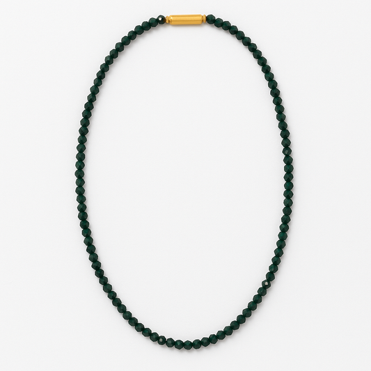 Green beaded necklace with a gold clasp on a white background
