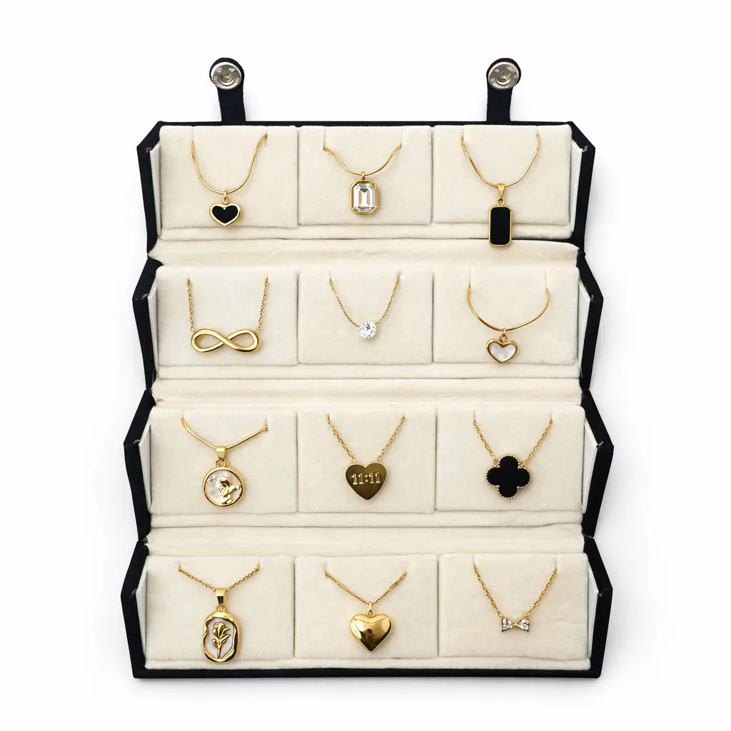 Jewelry display with various necklaces on a white background