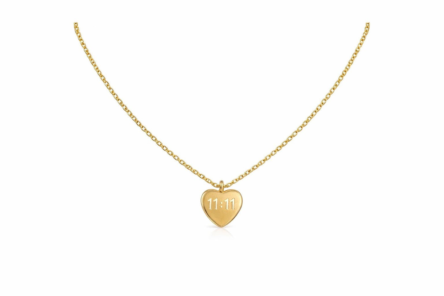 A delicate gold chain necklace with a small heart-shaped pendant engraved with the date '11.11', displayed on a clean white background.