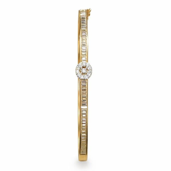 Gold bracelet with diamond accents on a white background