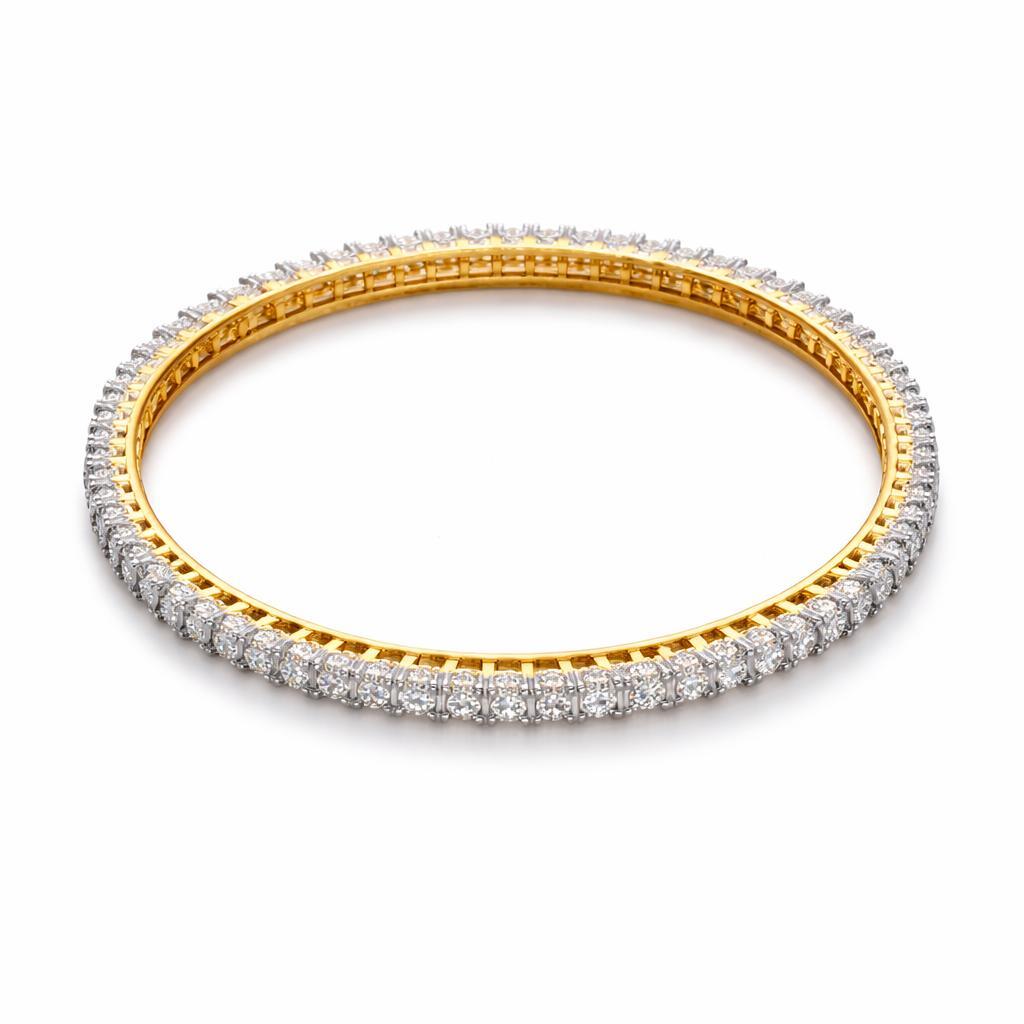 Gold and silver bracelet with diamonds on a white background