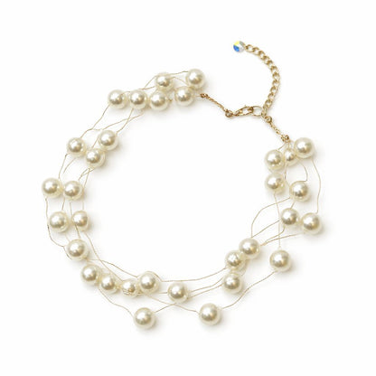 Multi-layered pearl necklace on a white background