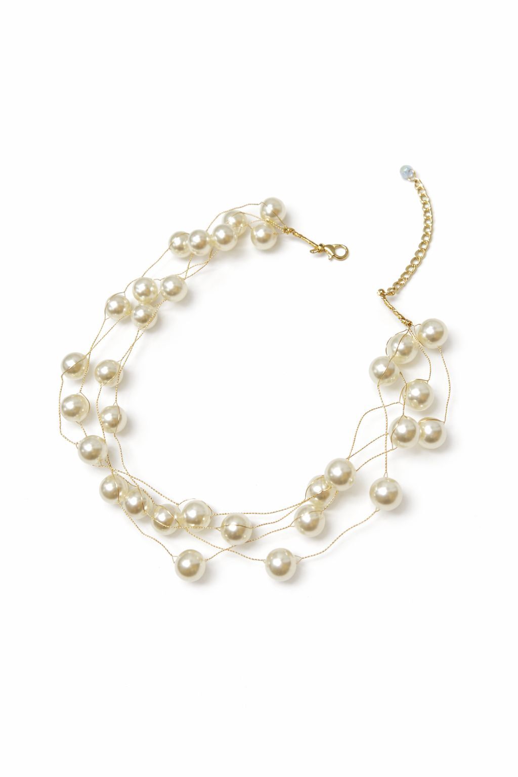 Pearl necklace with gold chain on a white background