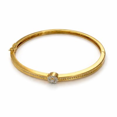 Gold bracelet with a diamond on a white background