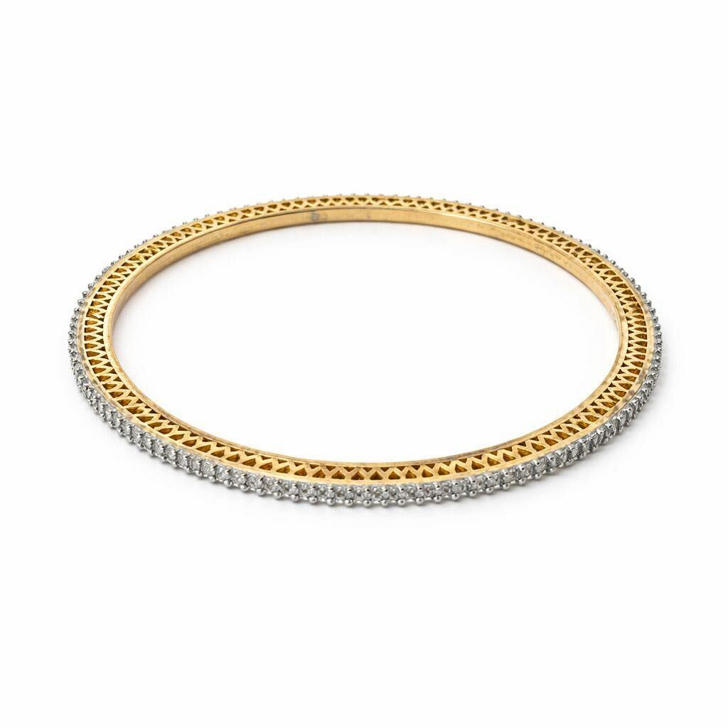 Gold bracelet with small diamonds on a white background
