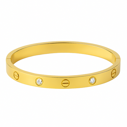 Gold bracelet with diamond accents on a white background